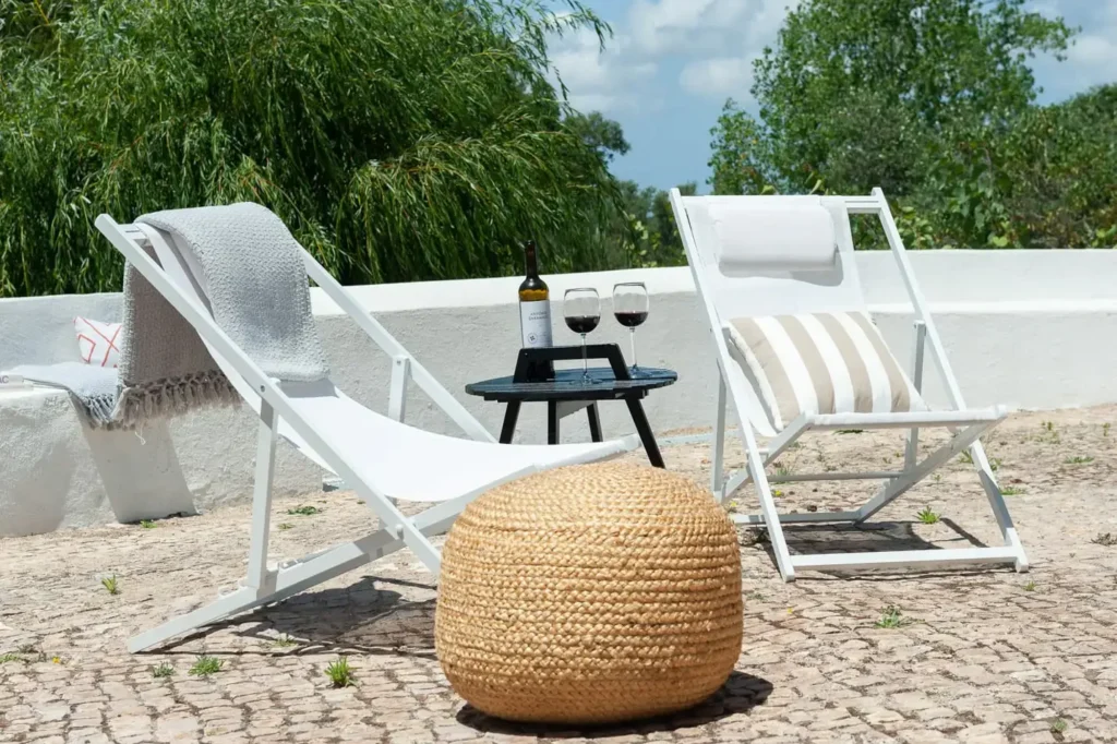 Photo of two chairs and a bottle of wine at the Pinetree's private terrace