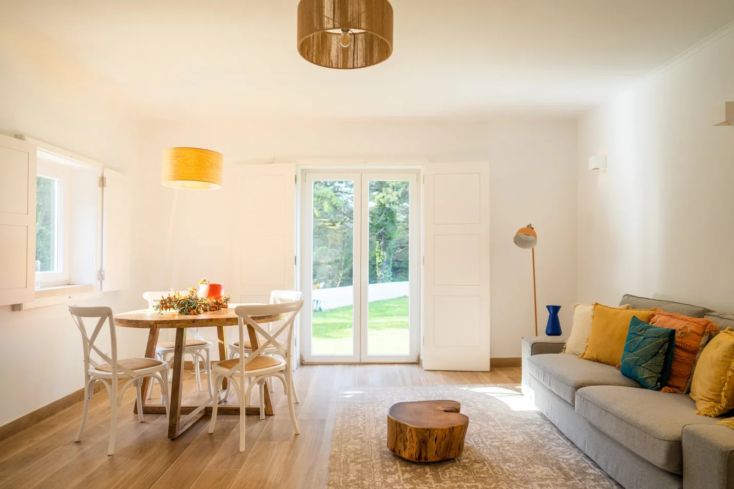 Wide-angle photo of the bright living room of the Wood Oven I house